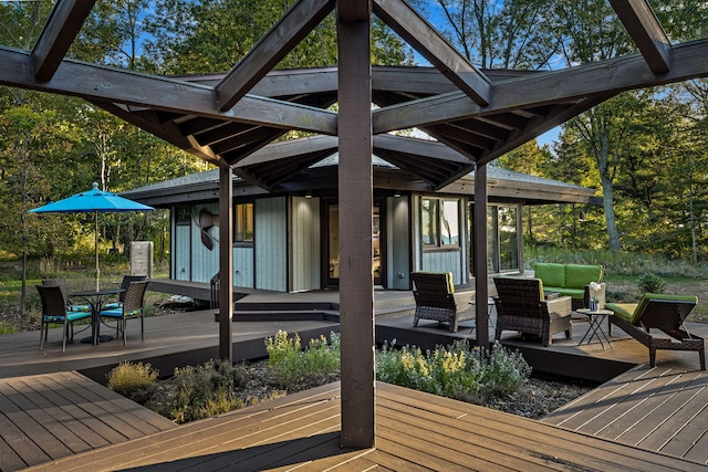 wooden terrace with outdoor lounge area