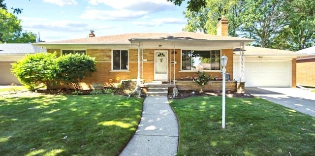 view of front of property with brick siding, a garage, a chimney, and a front yard