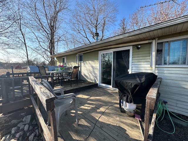 wooden deck with outdoor dining space