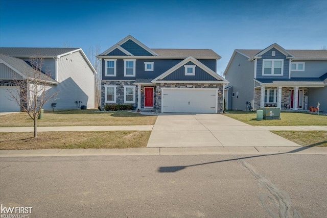 view of front of house with a front yard, stone siding, a garage, and driveway