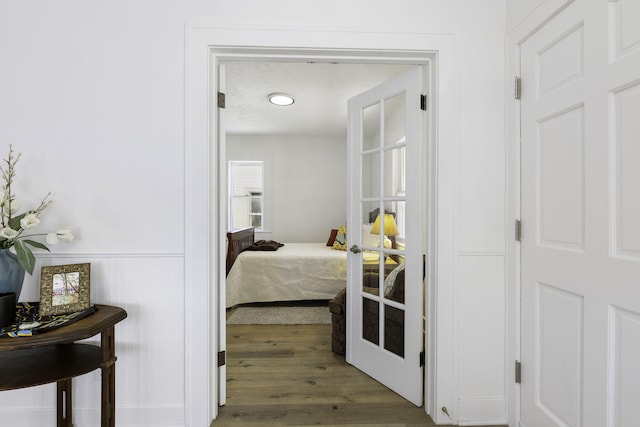 hall featuring french doors and wood finished floors