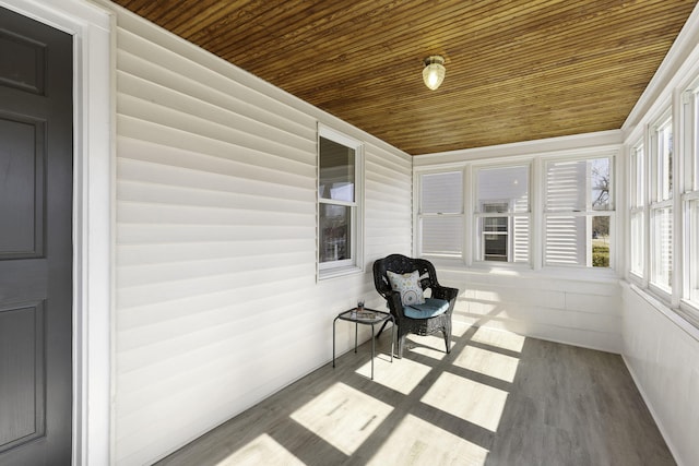 unfurnished sunroom featuring wood ceiling