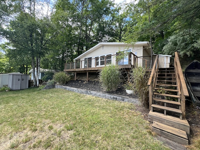 exterior space featuring a deck, stairs, a storage shed, and an outdoor structure