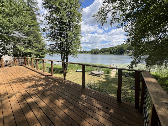 wooden deck featuring a water view