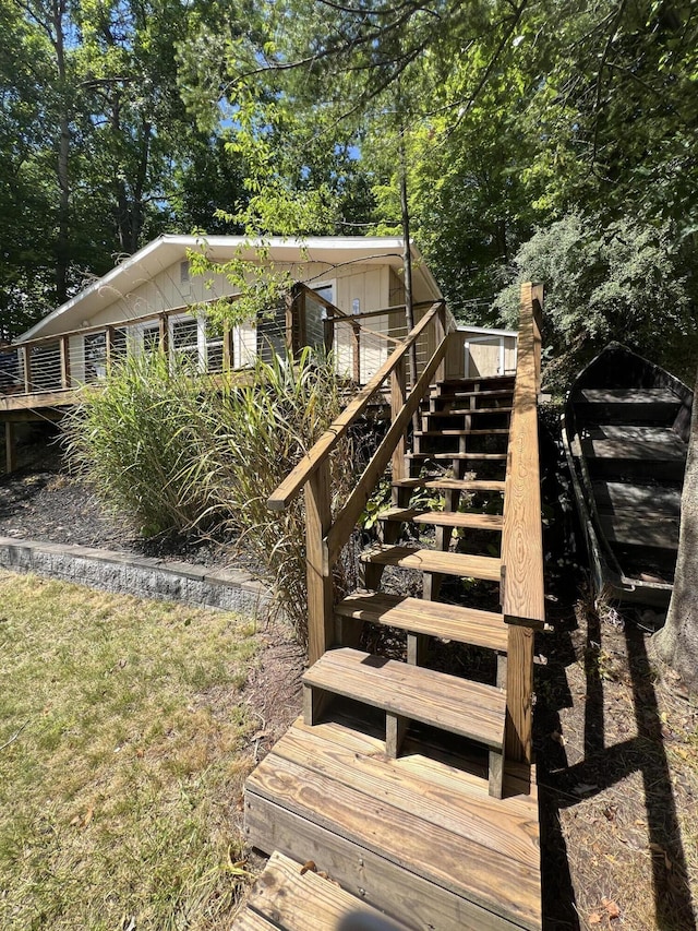 exterior space featuring a deck and stairs