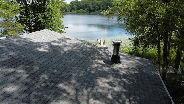 exterior details featuring a shingled roof