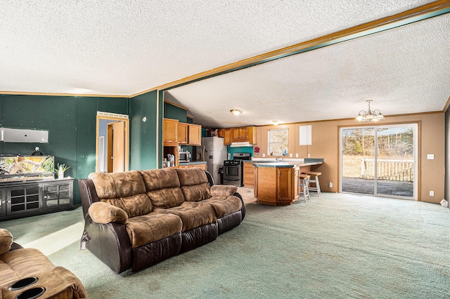 living area featuring a chandelier, ornamental molding, light carpet, vaulted ceiling, and a textured ceiling