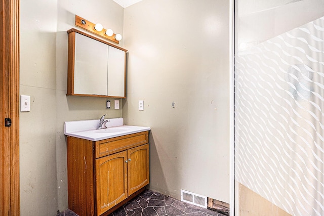 bathroom with visible vents and vanity