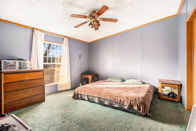 carpeted bedroom with a textured ceiling, ceiling fan, and crown molding