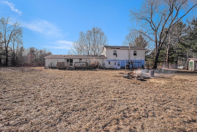 rear view of property with a deck