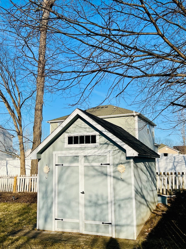 view of shed with fence