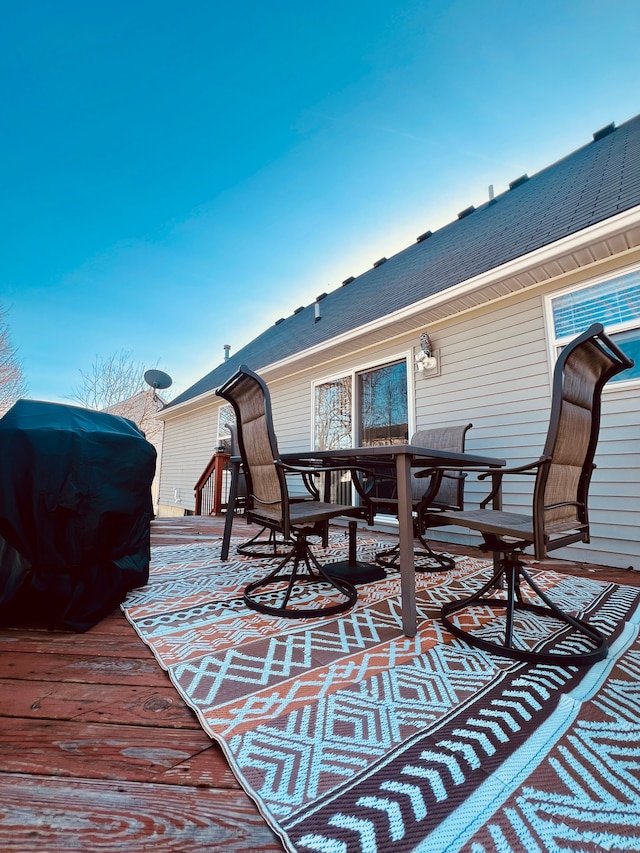 wooden deck with outdoor dining space