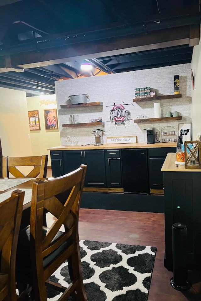 bar featuring dark wood-type flooring