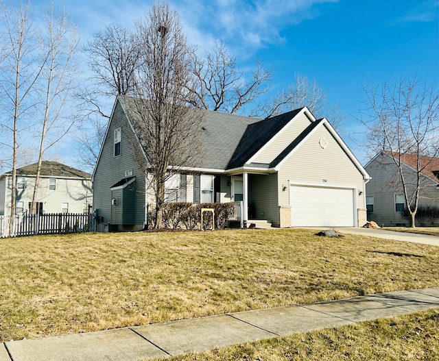 view of front facade with an attached garage, concrete driveway, a front yard, and fence