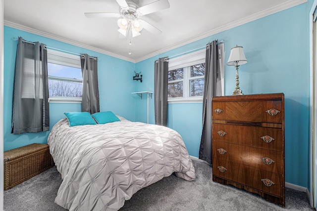 carpeted bedroom with baseboards, ceiling fan, and ornamental molding