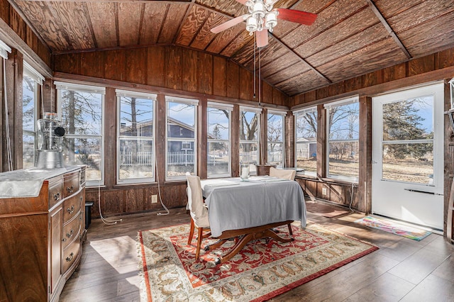 sunroom featuring vaulted ceiling, plenty of natural light, wood ceiling, and ceiling fan