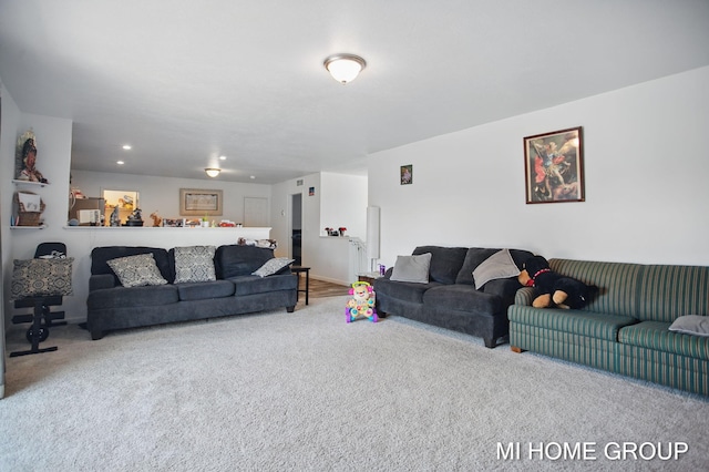 living area featuring recessed lighting and carpet floors