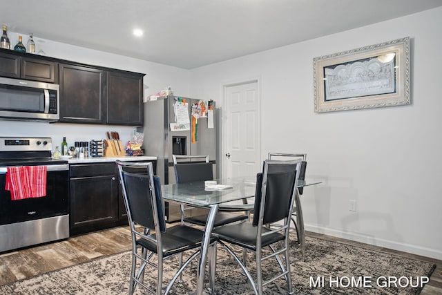 dining room with wood finished floors and baseboards