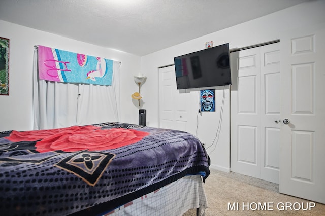 carpeted bedroom with a textured ceiling