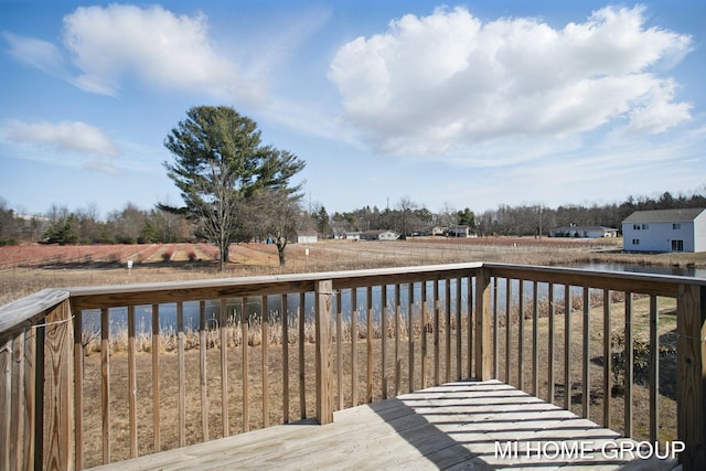 wooden deck featuring a water view