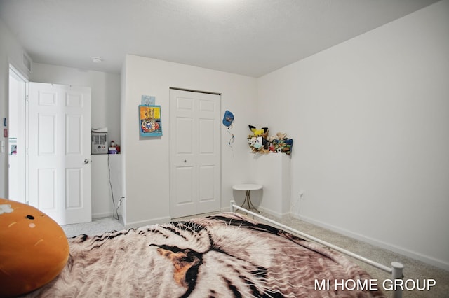 bedroom featuring carpet flooring, visible vents, and baseboards