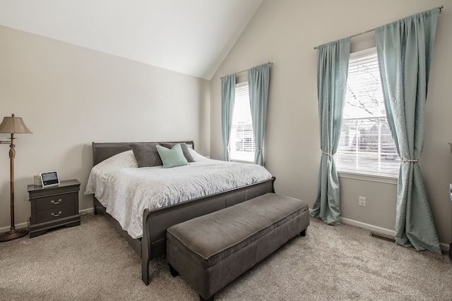 carpeted bedroom featuring vaulted ceiling, multiple windows, and baseboards