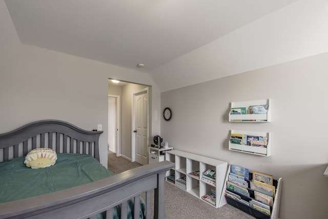 carpeted bedroom featuring lofted ceiling