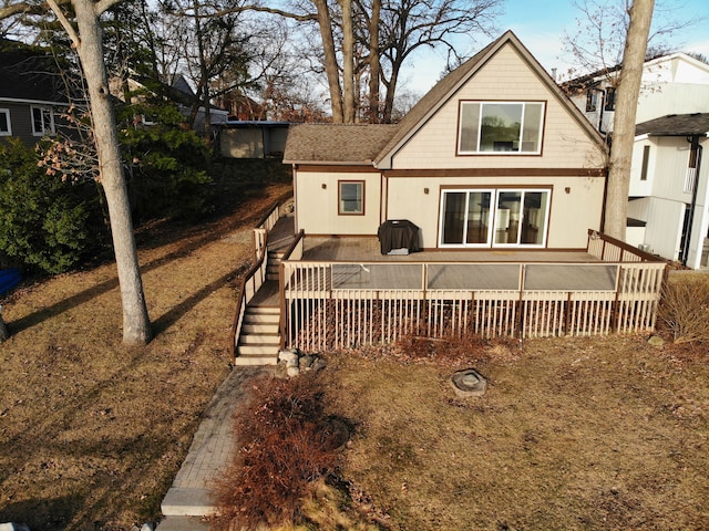 back of house featuring a deck