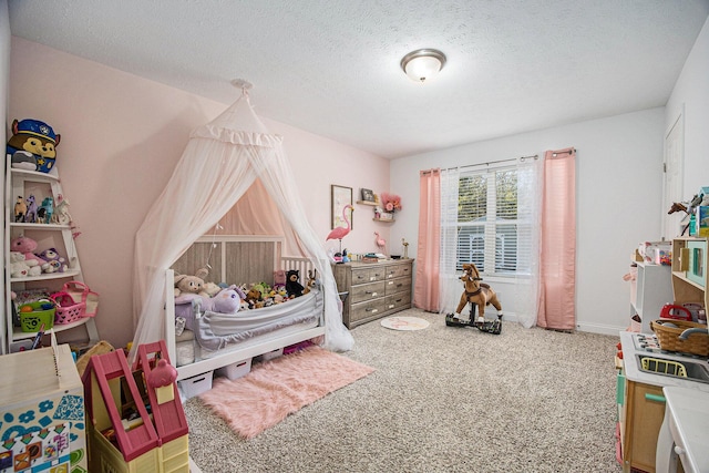 carpeted bedroom with a textured ceiling and baseboards