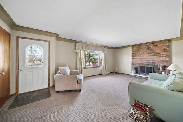 carpeted living room featuring baseboards and a brick fireplace