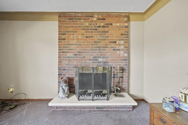 details with a brick fireplace, baseboards, and carpet