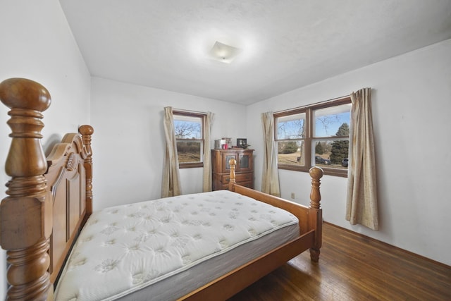 bedroom with wood finished floors