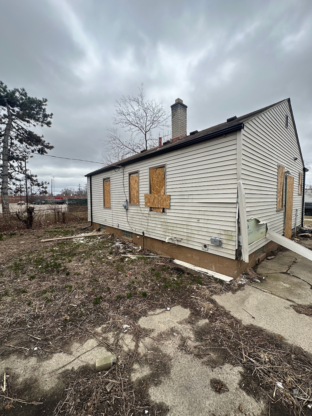 view of side of home with a chimney