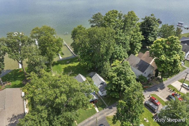 birds eye view of property with a residential view and a water view