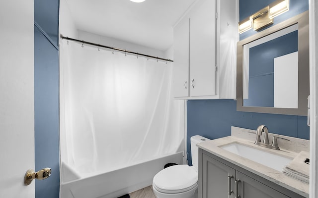 full bathroom featuring vanity, toilet, and shower / bathtub combination with curtain