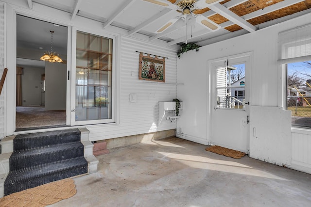 entrance to property featuring ceiling fan and a patio area