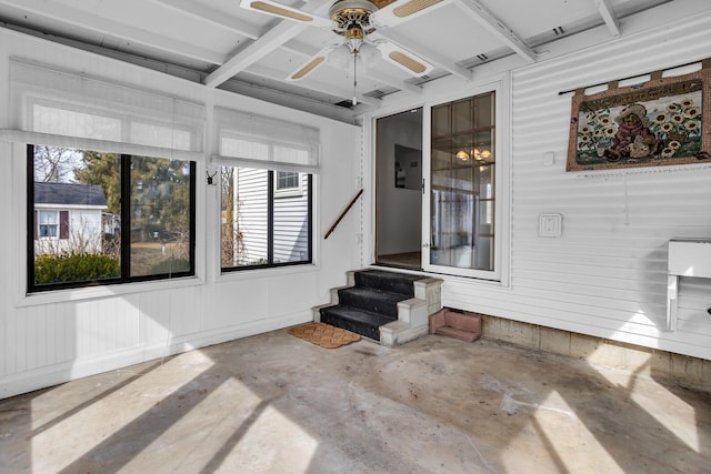 interior space with ceiling fan