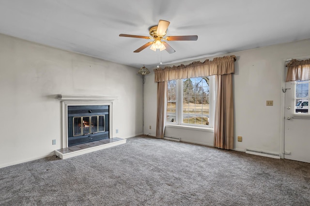 unfurnished living room with ceiling fan, a baseboard heating unit, a glass covered fireplace, and carpet flooring