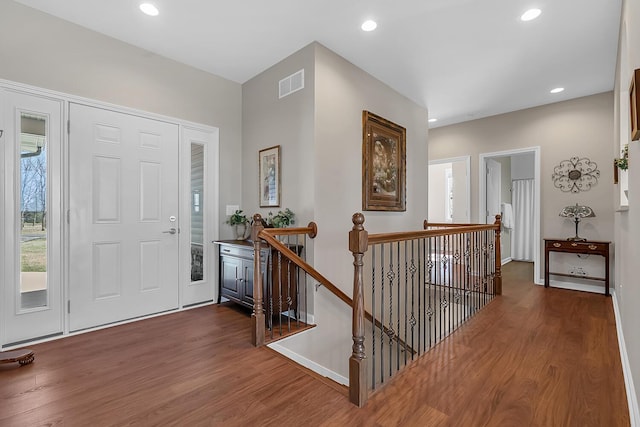 foyer with visible vents, recessed lighting, and wood finished floors