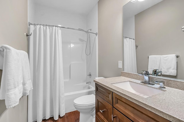 full bathroom with vanity, shower / bath combination with curtain, toilet, and wood finished floors