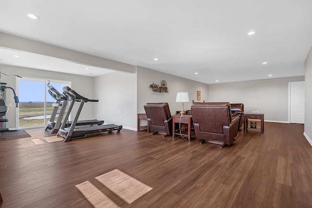 workout room featuring recessed lighting, wood finished floors, and baseboards