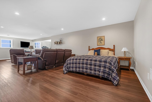 bedroom with recessed lighting, baseboards, and dark wood-type flooring