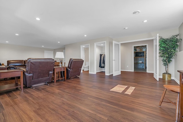 living area with recessed lighting, dark wood-style floors, and baseboards