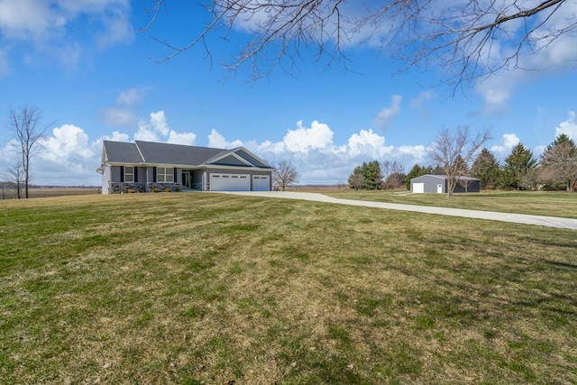 ranch-style home featuring an attached garage and a front yard