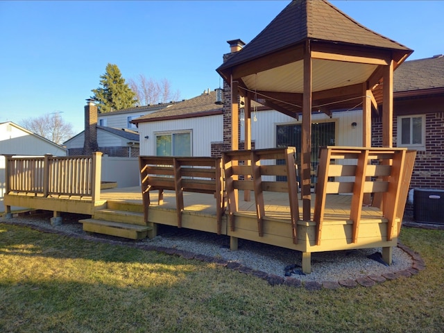 wooden deck featuring cooling unit and a yard