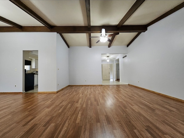 unfurnished living room with baseboards, a ceiling fan, and wood finished floors