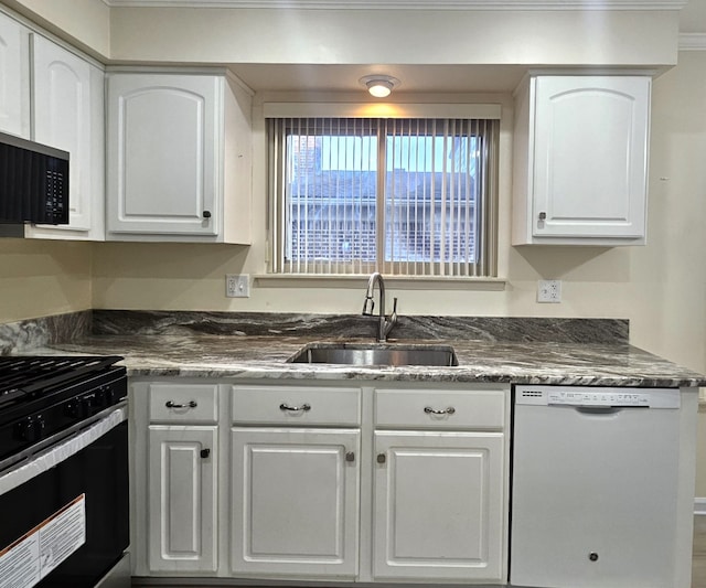 kitchen featuring dishwasher, black range with electric cooktop, white cabinetry, and a sink