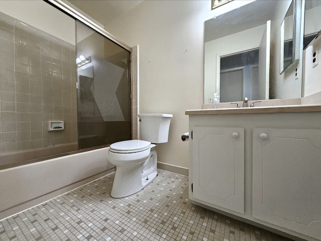 bathroom with tile patterned floors, toilet, baseboards, bath / shower combo with glass door, and vanity