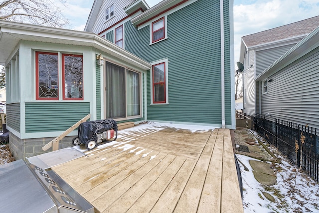 wooden terrace featuring fence