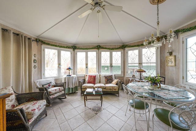 sunroom / solarium featuring a healthy amount of sunlight, lofted ceiling, and ceiling fan